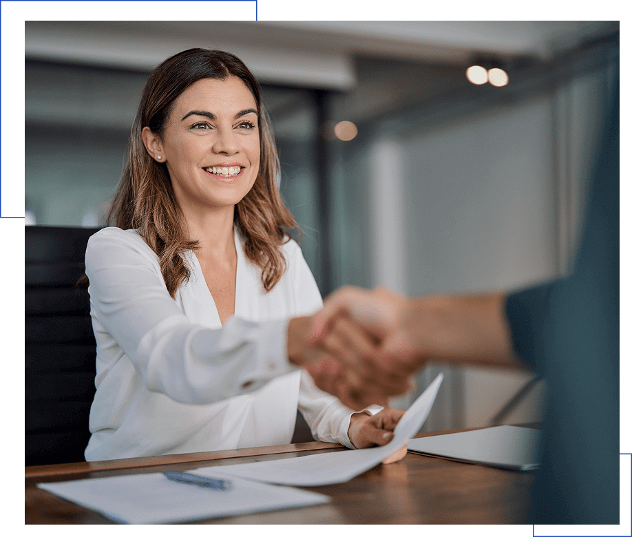 Businesswoman greeting client with handshake